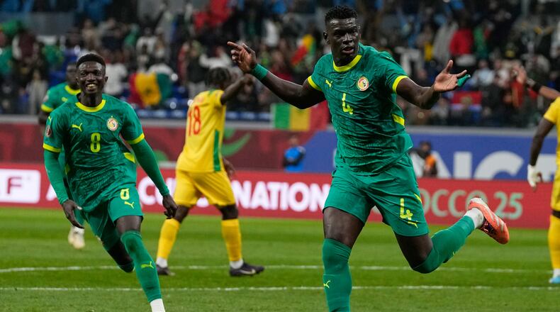 Senegal's Abdoulaye Seck, right, celebrate his goal with his teammates during the Africa Cup of Nations group D soccer match between Benin and Senegal in Tangier, Morocco, Tuesday, Dec. 30, 2025. (AP Photo/Themba Hadebe)