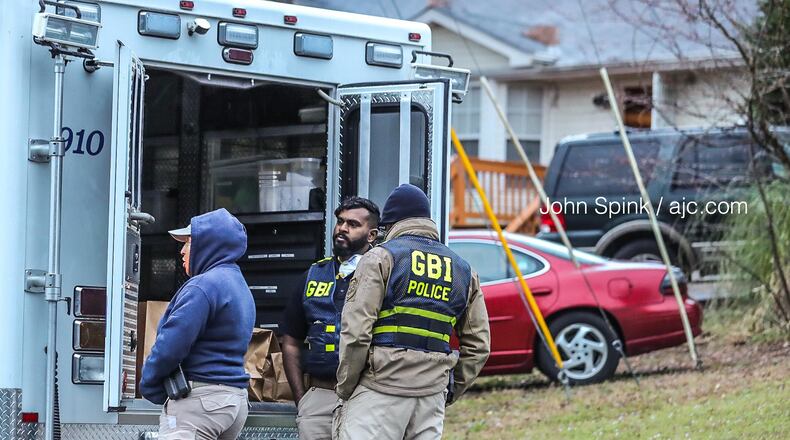 Palmetto police and GBI agents investigate a deadly shooting in a Palmetto neighborhood early Tuesday morning.