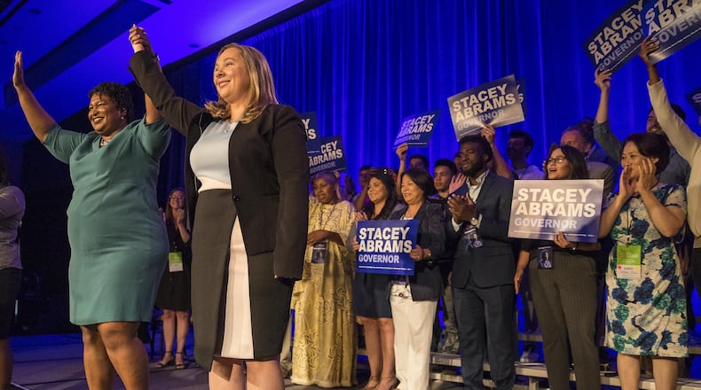 Georgia Democratic gubernatorial candidate Stacey Abrams (left) and Georgia Democratic lieutenant governor candidate Sarah Riggs Amico appeared Saturday at the state party’s convention in Atlanta. (ALYSSA POINTER/ALYSSA.POINTER@AJC.COM)