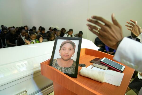 Mourners listen during the funeral service of Nigerian Ladi Anzaki Olubunmi, a TikTok content moderator employed by subcontractor Teleperformance, at Chiromo Funeral Parlour in Nairobi, Kenya Thursday, April. 17, 2025. (AP Photo/Brian Inganga)