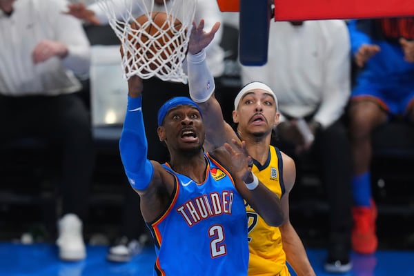 Oklahoma City Thunder guard Shai Gilgeous-Alexander, left, shoots against Indiana Pacers guard Andrew Nembhard during the second half of Game 7 of the NBA Finals basketball series Sunday, June 22, 2025, in Oklahoma City. (AP Photo/Nate Billings)