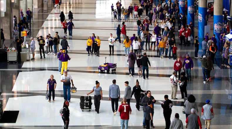 High-profile sports events are a foundation of Atlanta’s hospitality sector. Here, fans enter the Georgia World Congress Center for the Chick-fil-A Peach Bowl FanFest in 2019. STEVE SCHAEFER / SPECIAL TO THE AJC