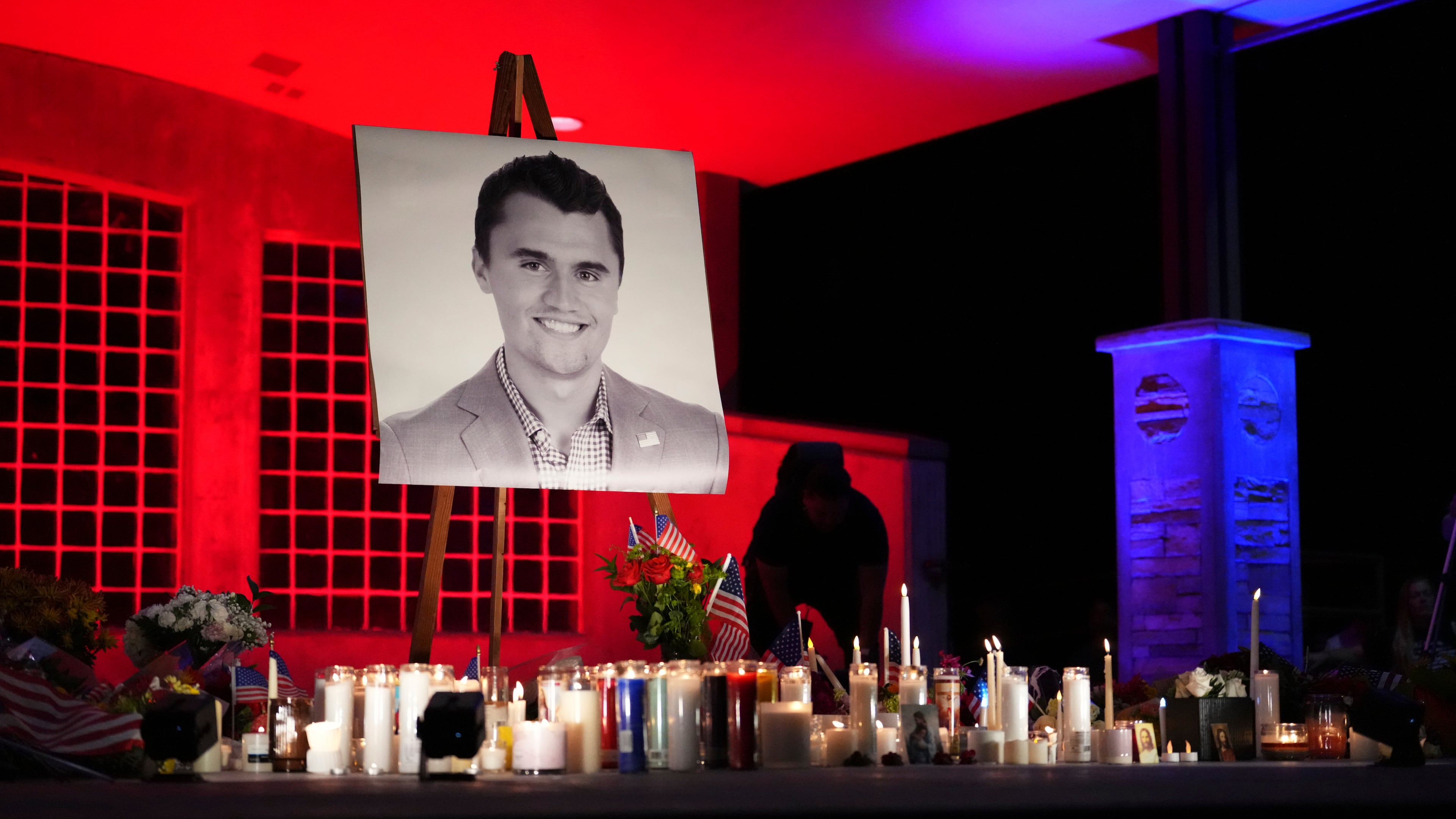 A photo of Charlie Kirk, the CEO and co-founder of Turning Point USA who was shot and killed, stands at his vigil, Thursday, Sept. 11, 2025, in Orem, Utah. (AP Photo/Lindsey Wasson)