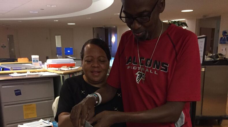Emory Saint Joseph s renal unit hosted a surprise wedding for patient Crawford Stratford and his fiance, Sabrina, shown here cutting their cake.