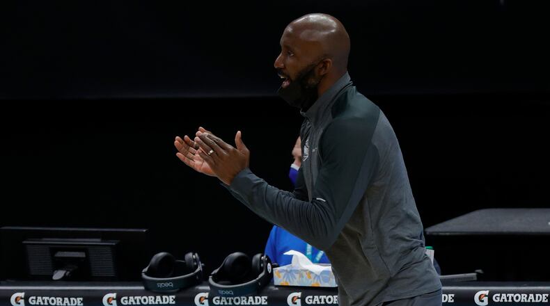 Coach Lloyd Pierce of the Atanta Hawks reacts following a call during the first quarter of their game against the Charlotte Hornets at Spectrum Center on Jan. 9, 2021 in Charlotte, North Carolina. (Jared C. Tilton/Getty Images/TNS)
