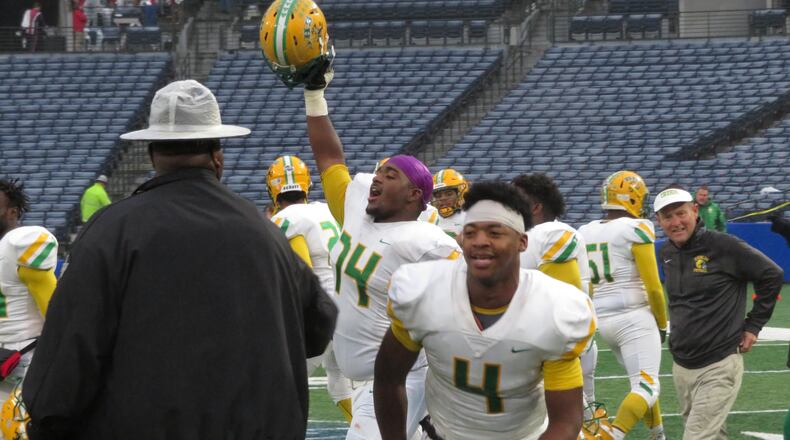 Dublin Fighting Irish players celebrate following their 42-32 win over the Brooks County Trojans in the Class AA championship game on Friday, Dec. 13, 2019 at Georgia State Stadium. (Adam Krohn)