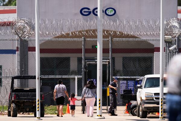 Visitors walk into the Central Louisiana ICE Processing Center in Jena, La., during an immigration hearing for Mahmoud Khalil, the Columbia University activist facing deportation for his role in pro-Palestinian campus protests, Friday, April 11, 2025. (AP Photo/Gerald Herbert)