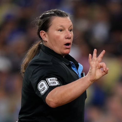 Home plate umpire Jen Pawol asks for more baseballs during the third inning of a baseball game between the Los Angeles Dodgers and the Los Angeles Angels, Friday, June 5, 2026, in Los Angeles. (AP Photo/Mark J. Terrill)