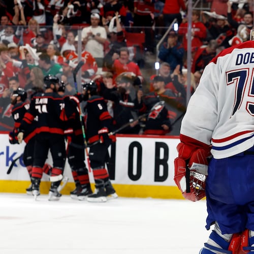 Carolina Hurricanes players celebrate after a goal by Nikolaj Ehlers as Montreal Canadiens goaltender Jakub Dobes (75) returns to the net during the second period in Game 2 of the Eastern Conference final NHL hockey Stanley Cup playoff series in Raleigh, N.C., Saturday, May 23, 2026. (AP Photo/Karl DeBlaker)
