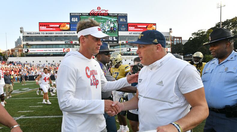 Ole Miss head coach Lane Kiffin and Georgia Tech's head coach Geoff Collins shake hands after the game. (Hyosub Shin / Hyosub.Shin@ajc.com)