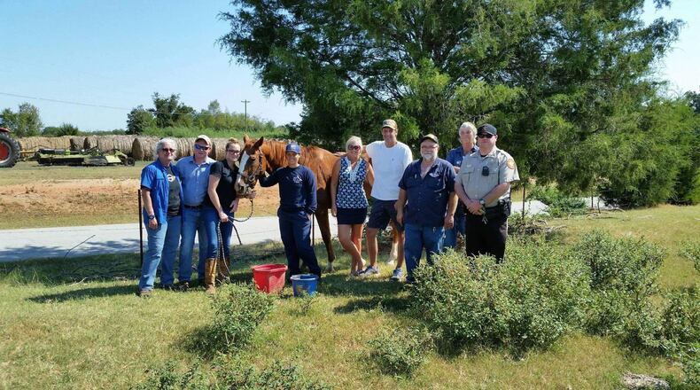 A group of law enforcement officials and family members went to Hartwell to pick up their horse Henry. (Family photo)