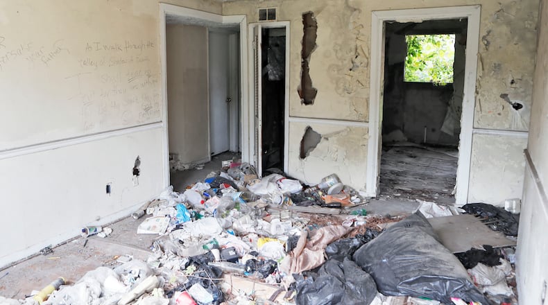Blighted property is not just a problem in South Fulton, as seen in this blighted Atlanta home on Bolton Road. BOB ANDRES/BANDRES@AJC.COM