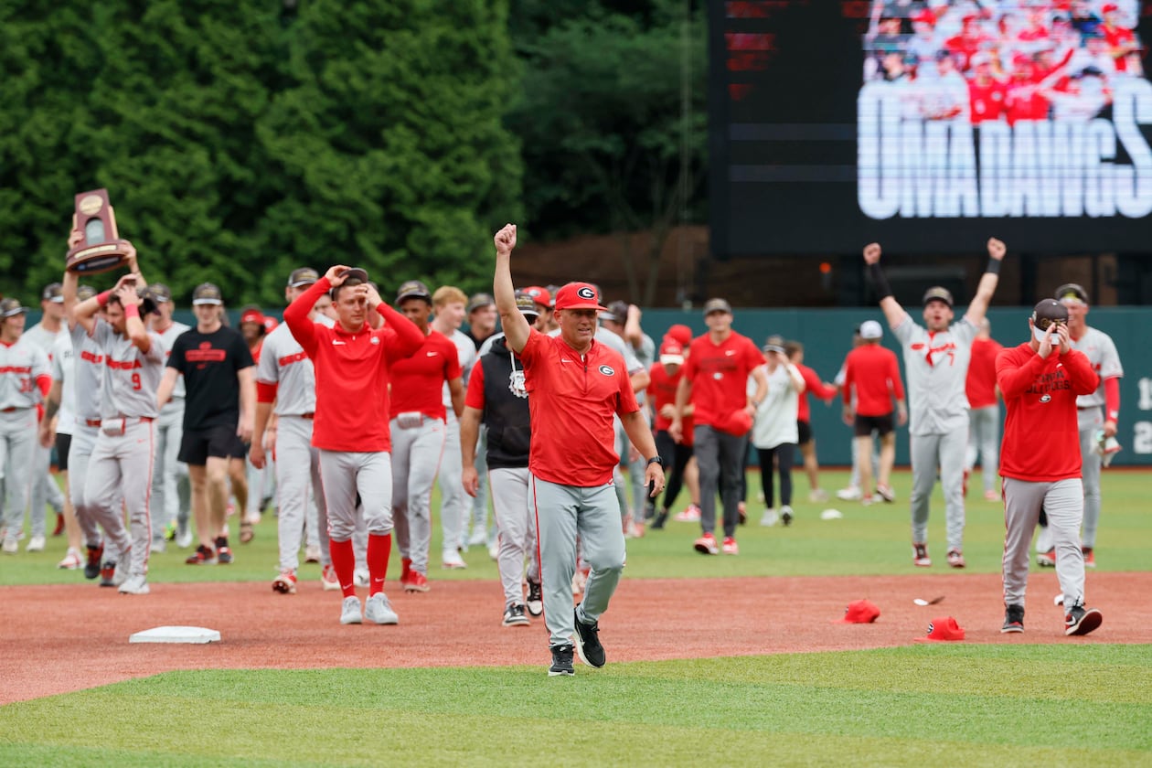 Georgia coach Wes Johnson (center) celebrates after UGA's super regional win over Mississippi State on Sunday, June 7, 2026, in Athens. Johnson has to replace many of players from the 2025 squad, which made the College World Series. (Miguel Martinez/AJC)