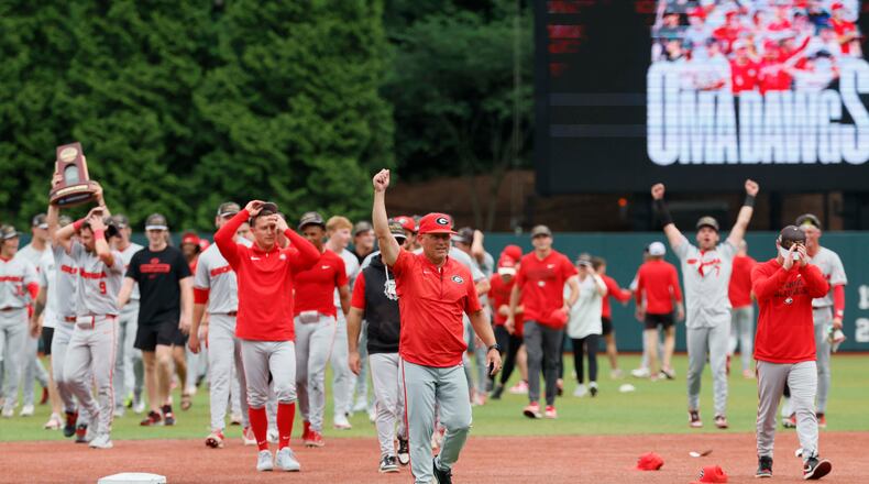 Georgia coach Wes Johnson (center) celebrates after UGA's super regional win over Mississippi State on Sunday, June 7, 2026, in Athens. Johnson has to replace many of players from the 2025 squad, which made the College World Series. (Miguel Martinez/AJC)