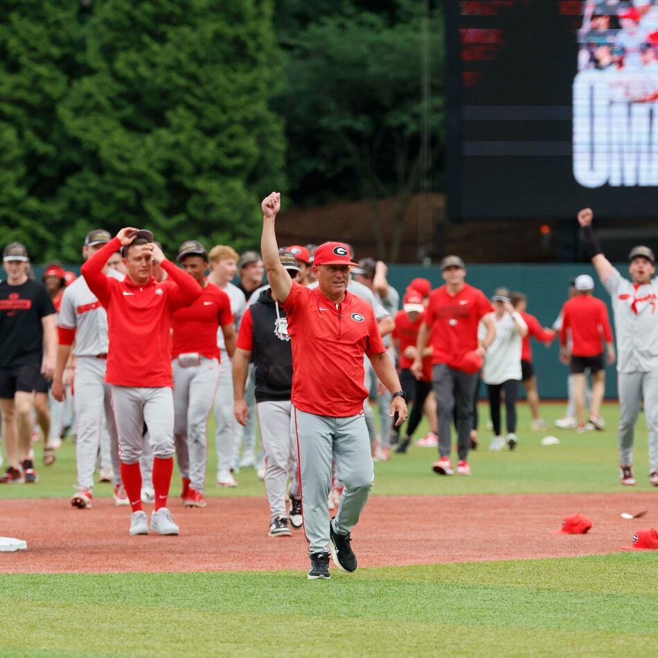 Georgia coach Wes Johnson (center) celebrates after UGA's super regional win over Mississippi State on Sunday, June 7, 2026, in Athens. Johnson has to replace many of players from the 2025 squad, which made the College World Series. (Miguel Martinez/AJC)