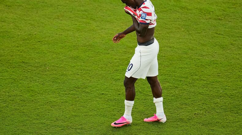 United States' Folarin Balogun (20) walks off the field after receiving a red card during the World Cup round of 32 soccer match between the United States and Bosnia in Santa Clara, Calif., near San Francisco, Wednesday, July 1, 2026. (AP Photo/Jeff Chiu)