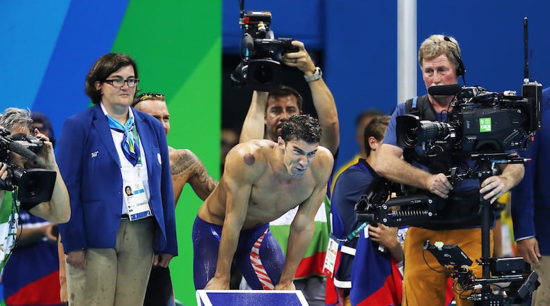 RIO DE JANEIRO, BRAZIL - AUGUST 07: Michael Phelps of United States looks on during the Men's 4 x 100m Freestyle Relay during Day 2 of the Rio 2016 Olympic Games at Olympic Aquatics Stadium on August 7, 2016 in Rio de Janeiro, Brazil. (Photo by Ian MacNicol/Getty Images)