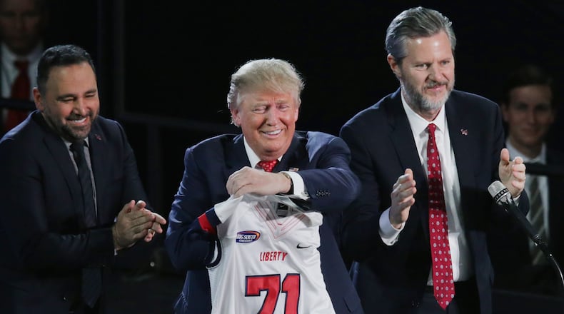 Liberty University President Jerry Falwell, Jr. (right) presents Republican presidential candidate Donald Trump with a sports jersey after he delivered the convocation at the university in Lynchburg, Va., last week. Chip Somodevilla/Getty Images