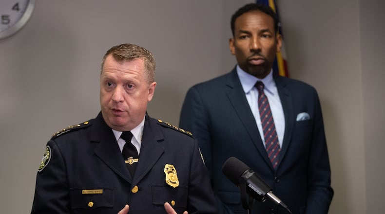 Interim Chief Darin Schierbaum (left) urged more residents and business owners to register their surveillance cameras with the city in an effort to solve and deter crime.
(Steve Schaefer / steve.schaefer@ajc.com)