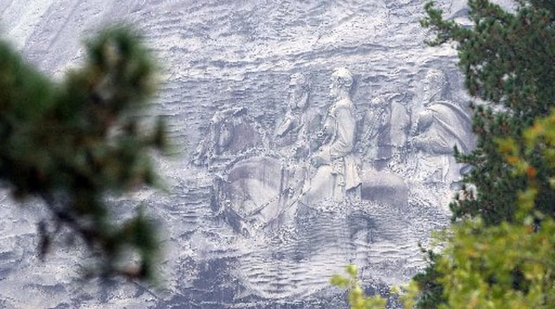 Stone Mountain is adorned with a huge carving depicting Confederate leaders, is classified as a Confederate memorial by state statute. KENT D. JOHNSON/KDJOHNSON@AJC.COM