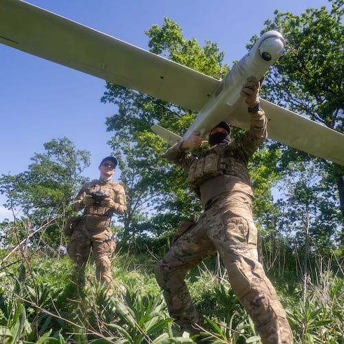 Ukrainian servicemen of Khartia brigade launch a drone towards Russian positions at the front line in the Kharkiv region, Ukraine, Wednesday, May 20, 2026. (AP Photo/Andrii Marienko)