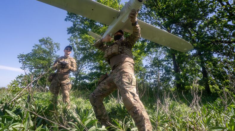 Ukrainian servicemen of Khartia brigade launch a drone towards Russian positions at the front line in the Kharkiv region, Ukraine, Wednesday, May 20, 2026. (AP Photo/Andrii Marienko)