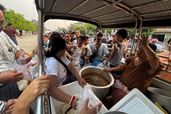 Victims line up for food on a road near Mandalay palace in the aftermath of Friday's earthquake in Mandalay, Myanmar, Wednesday, April 2, 2025. (AP Photo)