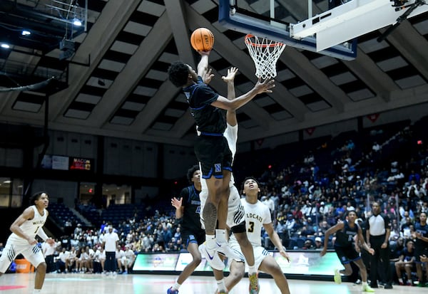Newton's Marcus Smith (0) goes to the basket for the shot during the second half of the GHSA Boys 6A State Championship at the Macon Centreplex, Saturday, March 8, 2025, in Macon. Wheeler won 61-56 over Newton. (Hyosub Shin / AJC)