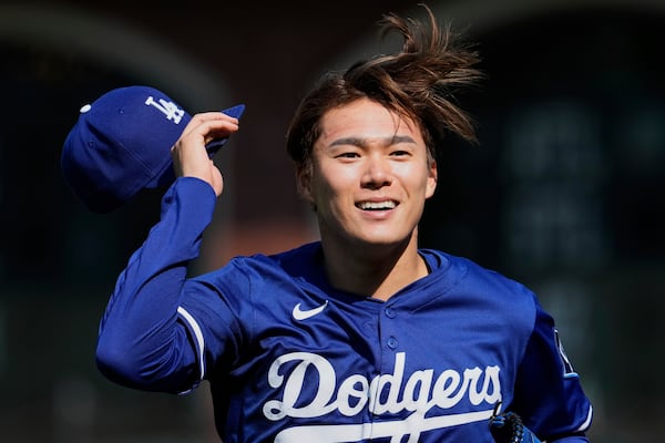 Los Angeles Dodgers' Yoshinobu Yamamoto walks to the dugout before a baseball game against the San Francisco Giants, Friday, July 11, 2025, in San Francisco. (AP Photo/Godofredo A. Vásquez)