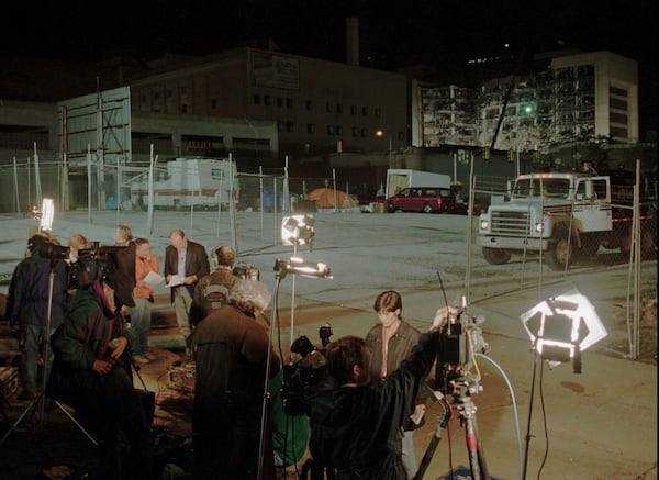 FILE - Television reporters report from the bombed Alfred P. Murrah Federal Building, back right, on April 20, 1995, in Oklahoma City. (AP Photo/Pat Sullivan, File)