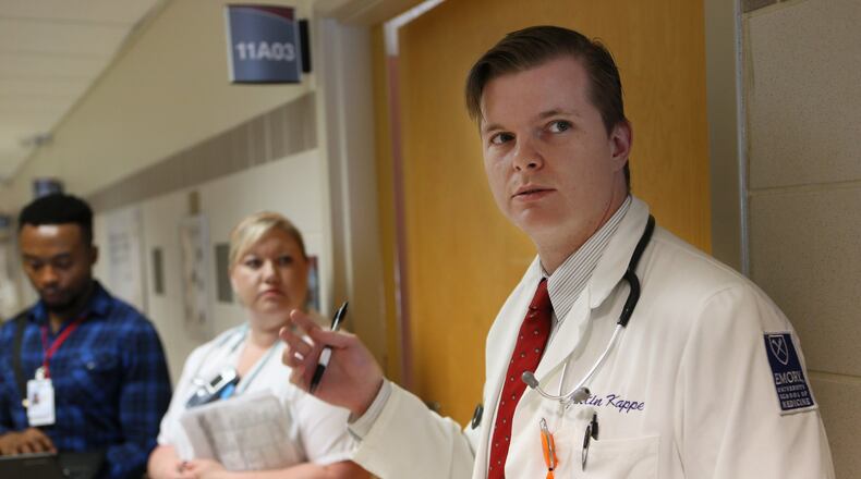 November 1, 2016 - Atlanta - Medical student Justin Kappel discusses a case while on morning rounds with Doctor and Professor of Medicine Ugochi Ohuabunwa, Grady Hospital’s head of geriatric medicine. Georgia has a shortage of doctors who specialize in care for senior citizens, even as the number of seniors is exploding. A national health study found 125 certified geriatricians in the state, while there’s a need for 450. BOB ANDRES /BANDRES@AJC.COM