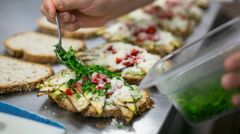The chef assembles antipasti sandwiches at Crema Espresso in Dunwoody.