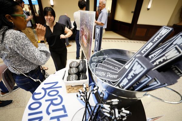 North Point promotional items are shown at the Alpharetta City Hall Council Chamber on Monday, Aug. 24, 2026, during a public hearing where the City Council is considering a master plan amendment, to allow the redevelopment of North Point Mall as a mixed-use development in hopes of securing an NHL franchise. (Miguel Martinez/AJC)