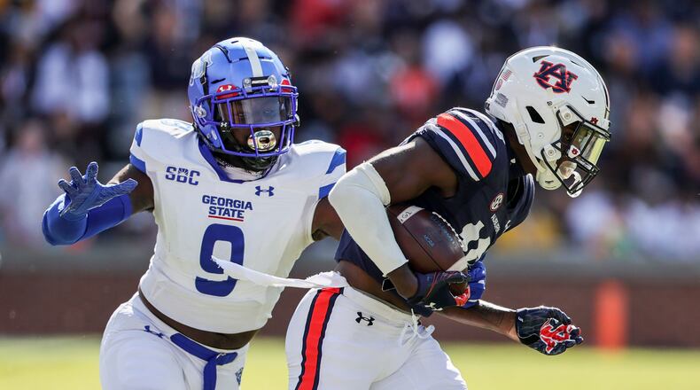 Auburn cornerback Nehemiah Pritchett (18) tries to get past Georgia State linebacker Jamil Muhammad (9) on a kick return during the first half of an NCAA football game Saturday, Sept. 25, 2021, in Auburn, Ala. (AP Photo/Butch Dill)