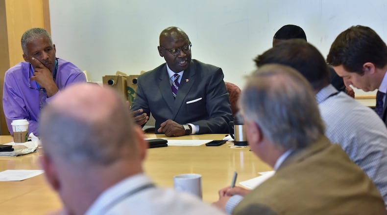 Roosevelt Council, (center), general manager at Hartsfield-Jackson International, leads a weekly meeting on the airport’s $6 billion long-range expansion program.