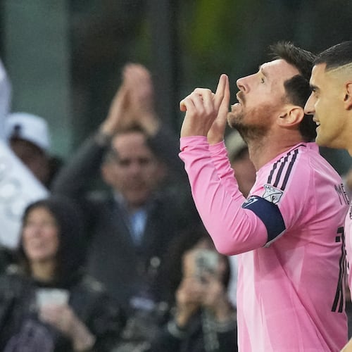 Inter Miami forward Lionel Messi gestures after scoring his 900th goal during a CONCACAF Champions Cup Round of 16 soccer match against Nashville, Wednesday, March 18, 2026, in Fort Lauderdale, Fla. (AP Photo/Marta Lavandier)