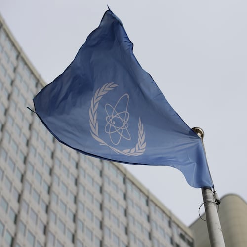 FILE - The flag of the International Atomic Energy Agency flies in front of its headquarters during an IAEA Board of Governors meeting in Vienna, Austria, on Feb. 6, 2023. (AP Photo/Heinz-Peter Bader, File)