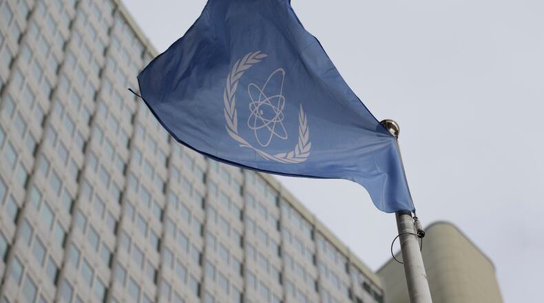 FILE - The flag of the International Atomic Energy Agency flies in front of its headquarters during an IAEA Board of Governors meeting in Vienna, Austria, on Feb. 6, 2023. (AP Photo/Heinz-Peter Bader, File)