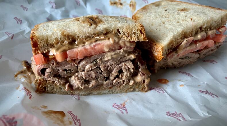 The lamb sandwich from Alon's is a simple, satisfying summer pleasure. Henri Hollis/henri.hollis@ajc.com