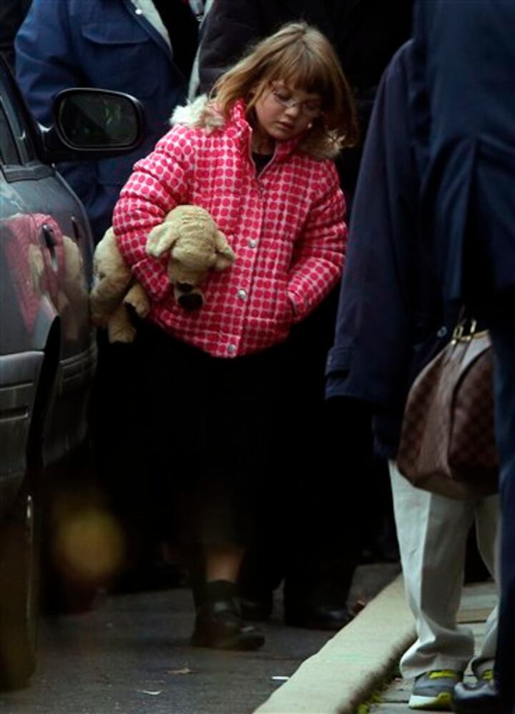 Newtown holds the first funerals for the victims