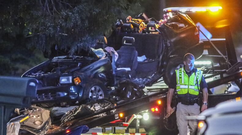 Austell: Two adults were killed and four children were seriously injured when an SUV hit a tree early Monday, June 20, 2016 along Clay Road in Cobb County. JOHN SPINK /JSPINK@AJC.COM