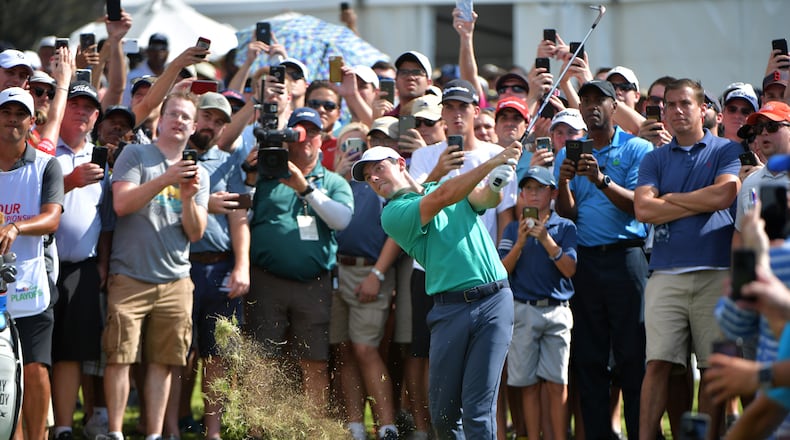 Fans get an up close and personal view of Rory McIlroy during the 2018 Tour Championship.  HYOSUB SHIN / HSHIN@AJC.COM