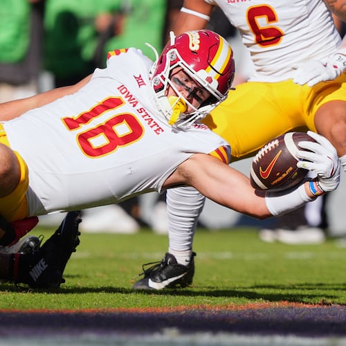 Iowa State tight end Benjamin Brahmer (18) scores a touchdown against TCU defenders Vernon Glover (26), Jamel Johnson (2) and Devean Deal (11) during the first half of an NCAA college football game Saturday, Nov. 8, 2025, in Fort Worth, Texas. (AP Photo/LM Otero)