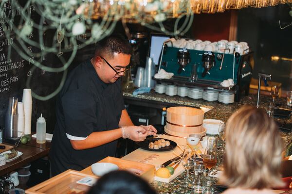 Chef Jorom Paler prepares sushi during his omakase pop-up at Larakin wine bar. (Courtesy of Hunter Peacock)