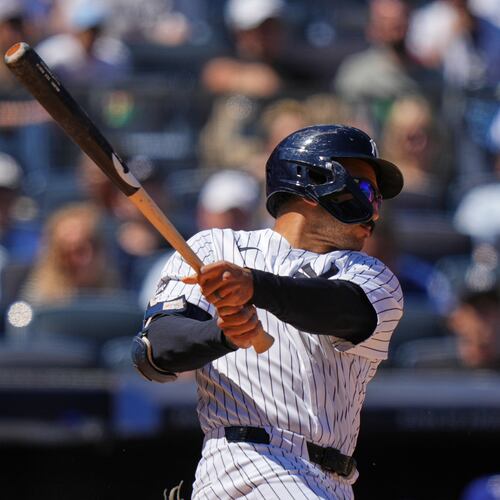 New York Yankees' Trent Grisham follows through on a three-run double during the sixth inning of a baseball game against the Texas Rangers Thursday, May 7, 2026, in New York. (AP Photo/Frank Franklin II)