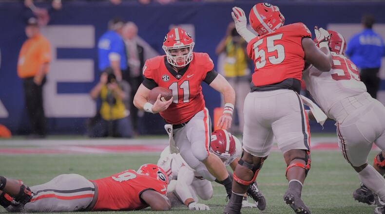 Georgia quarterback Jake Fromm (11) runs with the football during the second half of the SEC Football Championship at Mercedes-Benz Stadium on Saturday, December 1, 2018. Alabama won 35-28 over the Georgia. HYOSUB SHIN / HSHIN@AJC.COM