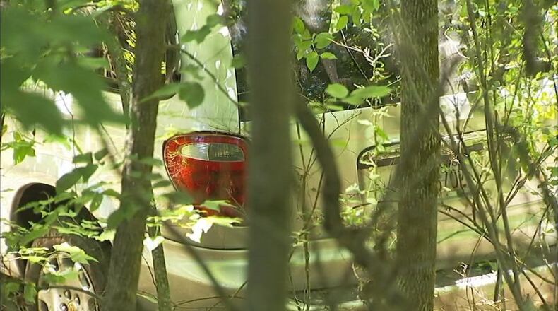 A stolen car landed in a ravine after a police chase Tuesday morning. (Credit: Channel 2 Action News)