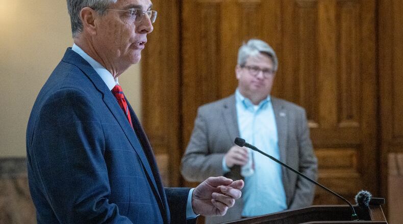 Secretary of State Brad Raffensperger talks Tuesday at a Capitol press conference while interim Deputy Secretary of State Gabriel Sterling looks on. Raffensperger said that Georgia's election turnout surged past 1 million voters Tuesday. Steve Schaefer/steve.schaefer@ajc.com)