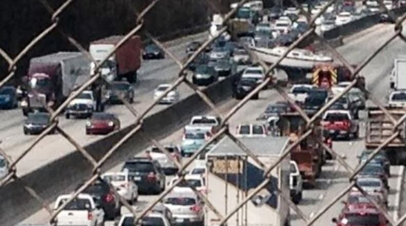 A boat has most of northbound I-285 near Chamblee Tucker Road blocked. (Credit: Ben Hansberger)