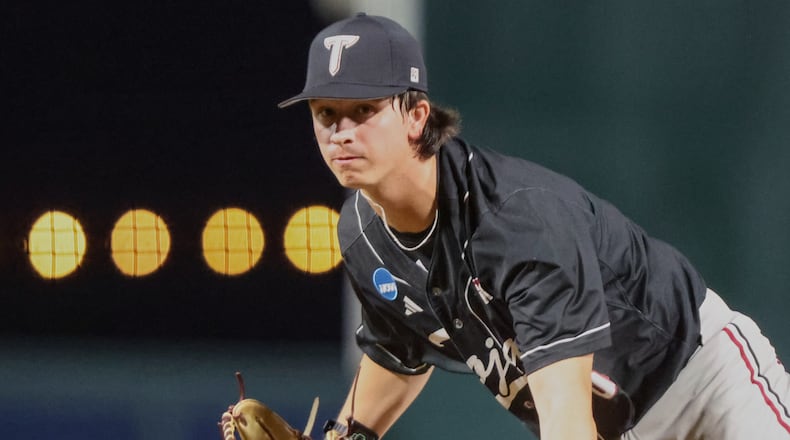 FILE - Troy pitcher Benjamin Stubbs throws during an NCAA regional baseball game against Miami on May 29, 2026, in Gainesville, Fla. (AP Photo/Gary McCullough, File)